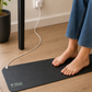 Feet resting on grounding mat
